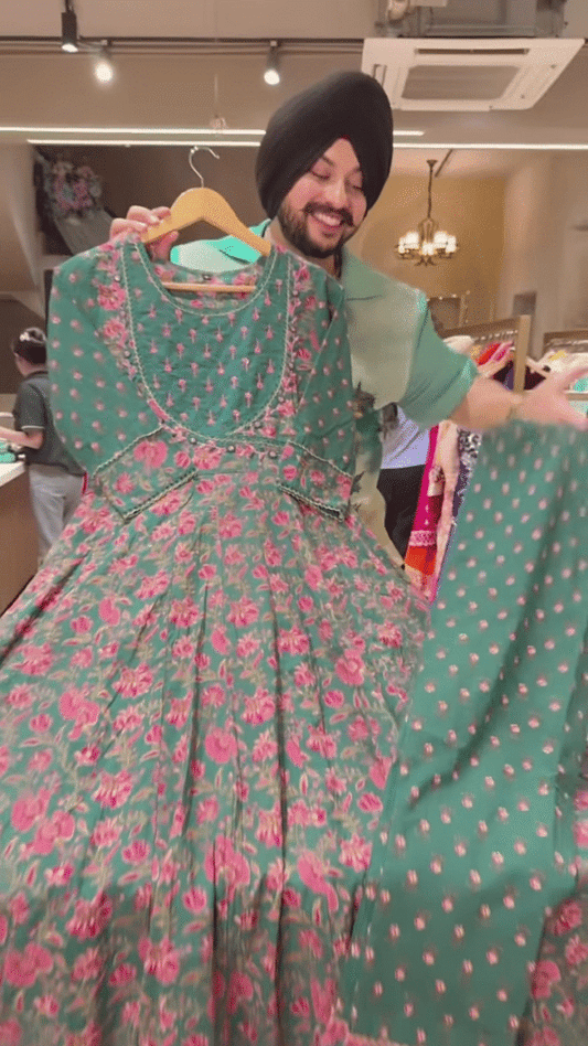 Green Floral Printed Ethnic Dress with Embroidered Neckline and Coordinated Fabric Panel