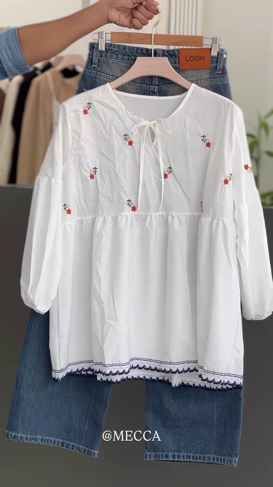 White Floral Embroidered Blouse with Tie Neck – Casual Chic Top Paired with Blue Jeans