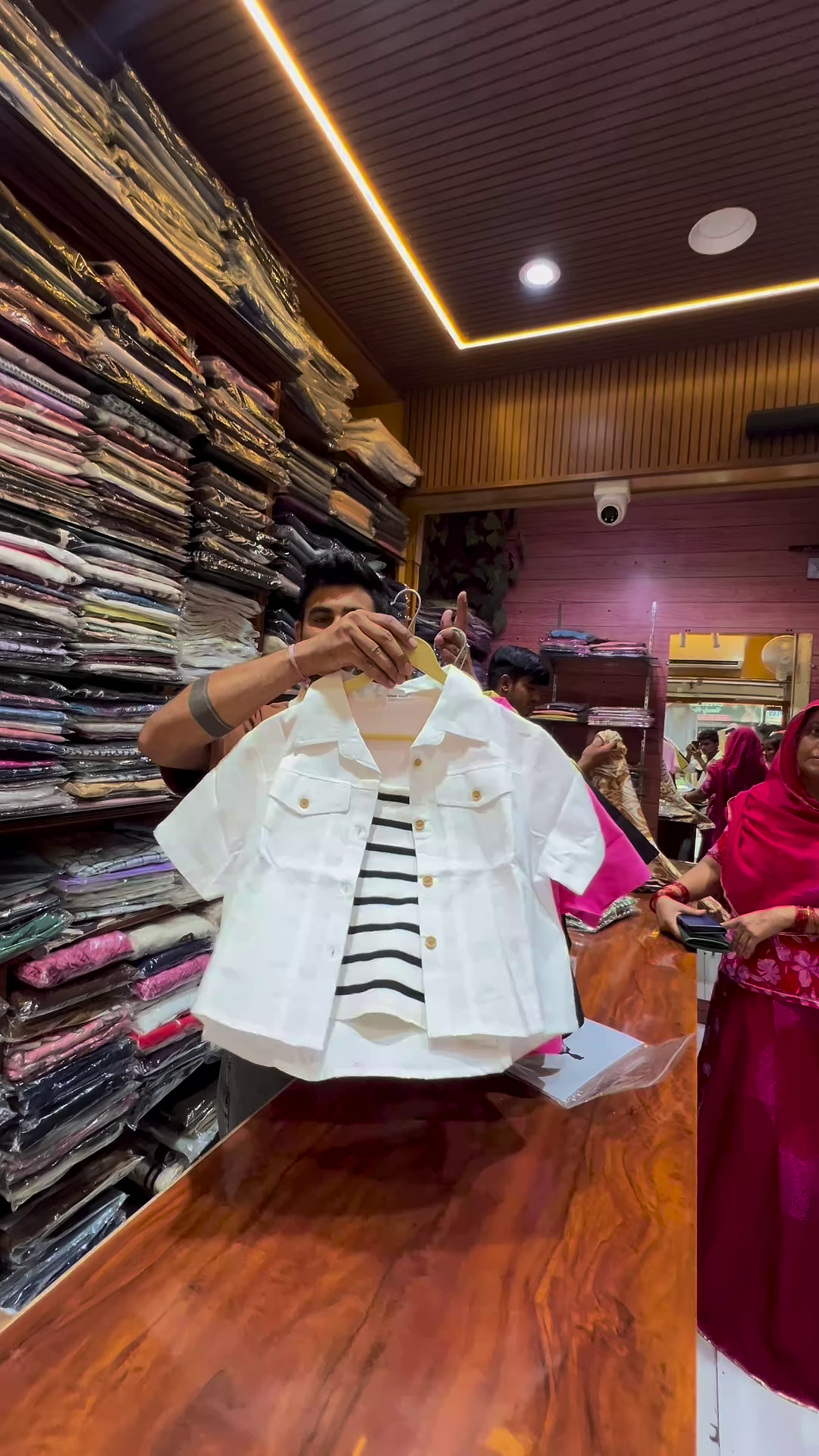 White Buttoned Utility Jacket with Chest Flap Pockets over Striped Inner Layer