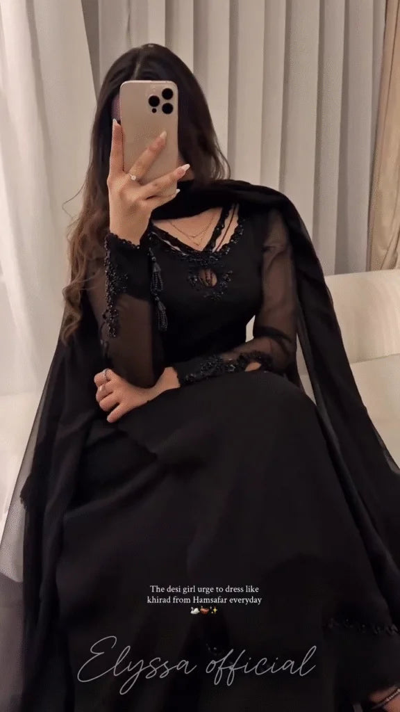 long, floor-length gown or A-line abaya/dress in solid black