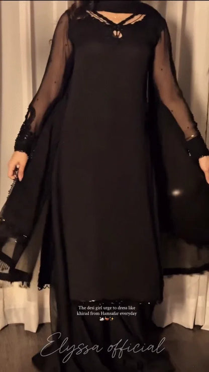 long, floor-length gown or A-line abaya/dress in solid black