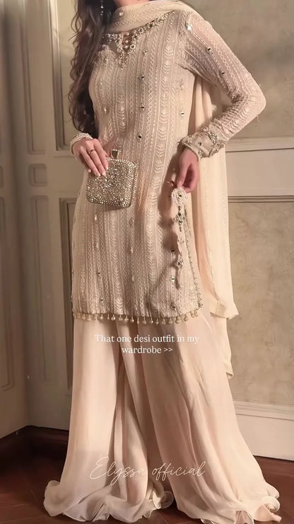 A Monochromatic Ensemble Featuring Delicately Flowing Fabrics and Sparkling Mirror Work