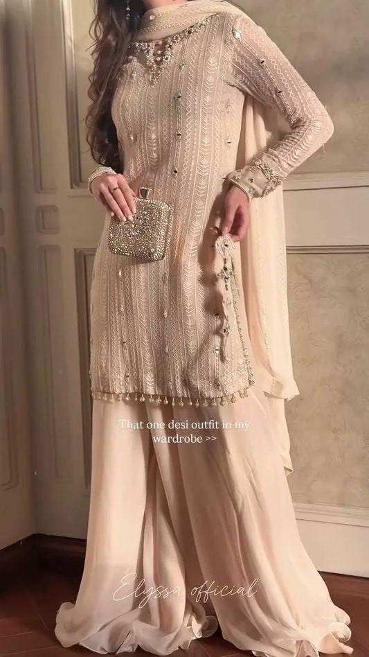 A Monochromatic Ensemble Featuring Delicately Flowing Fabrics and Sparkling Mirror Work